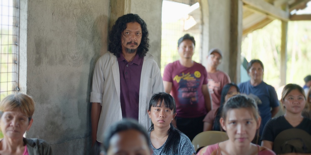 ganggang-10 – Jun and his wife Linda listen with the villagers during a townhall meeting – Mona Nieva